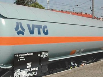 Gray liquid gas tank car with orange stripe and blue VTG logo.