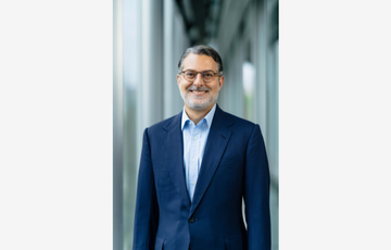 Man wearing glasses and a suit