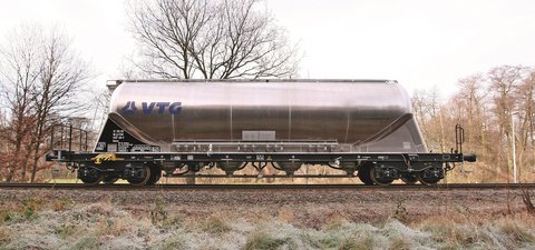 Silver dust car with blue VTG logo.