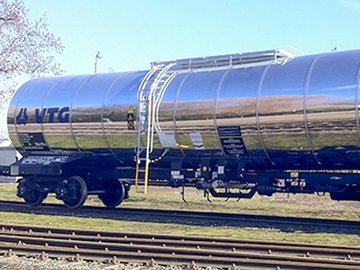 Silver chemical tank car with blue VTG logo.