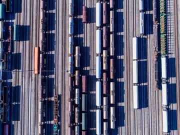 Wagons on multiple rail tracks from above 