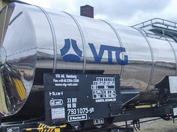 Silver chemical tank car with blue VTG logo.
