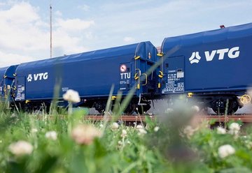 Several blue VTG wagons hitched together.