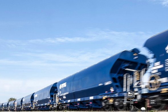 Blue VTG standard freight wagons under blue skies
