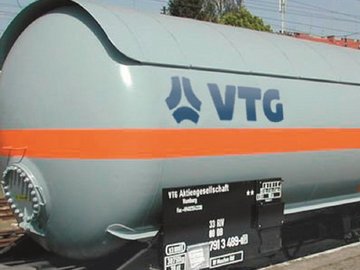 Gray liquid gas tank car with orange stripe and blue VTG logo.