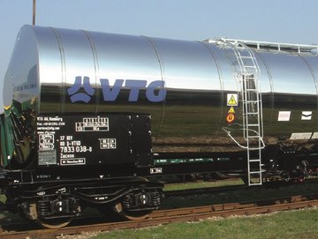 Silver chemical tank car with blue VTG logo.