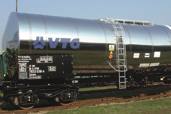 Silver chemical tank car with blue VTG logo.