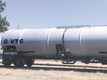 White chemical tank car with blue VTG logo.