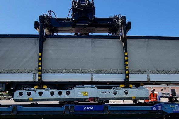 Container is loaded onto a wagon.