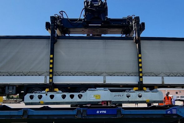 Container is loaded onto a wagon.