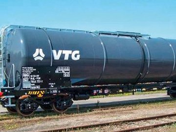 Dark gray chemical tank car with white VTG logo.