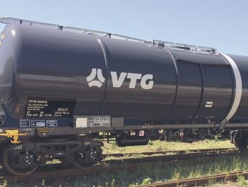Dark gray chemical tank car with white VTG logo.