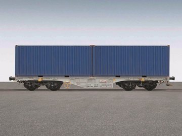 Gray container car with a blue container on it.