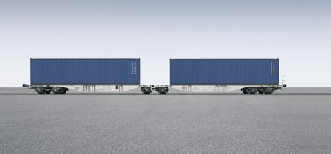 Gray container car with two blue containers on it.