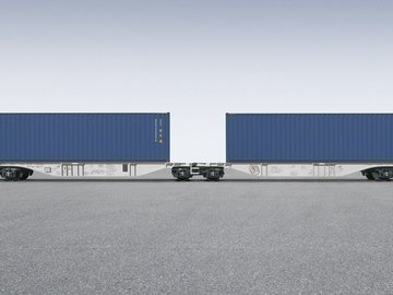 Gray container car with two blue containers on it.