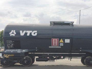 Dark gray chemical tank car with white VTG logo.